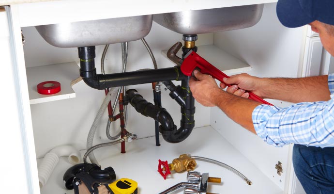 Plumber repairing sink Plumber repairing sink