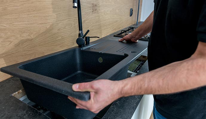Black composite sink installation Black composite sink installation