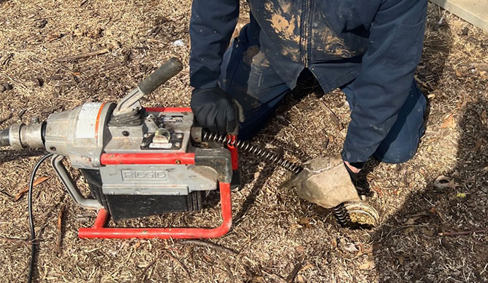 Inspecting clogged drain using equipment